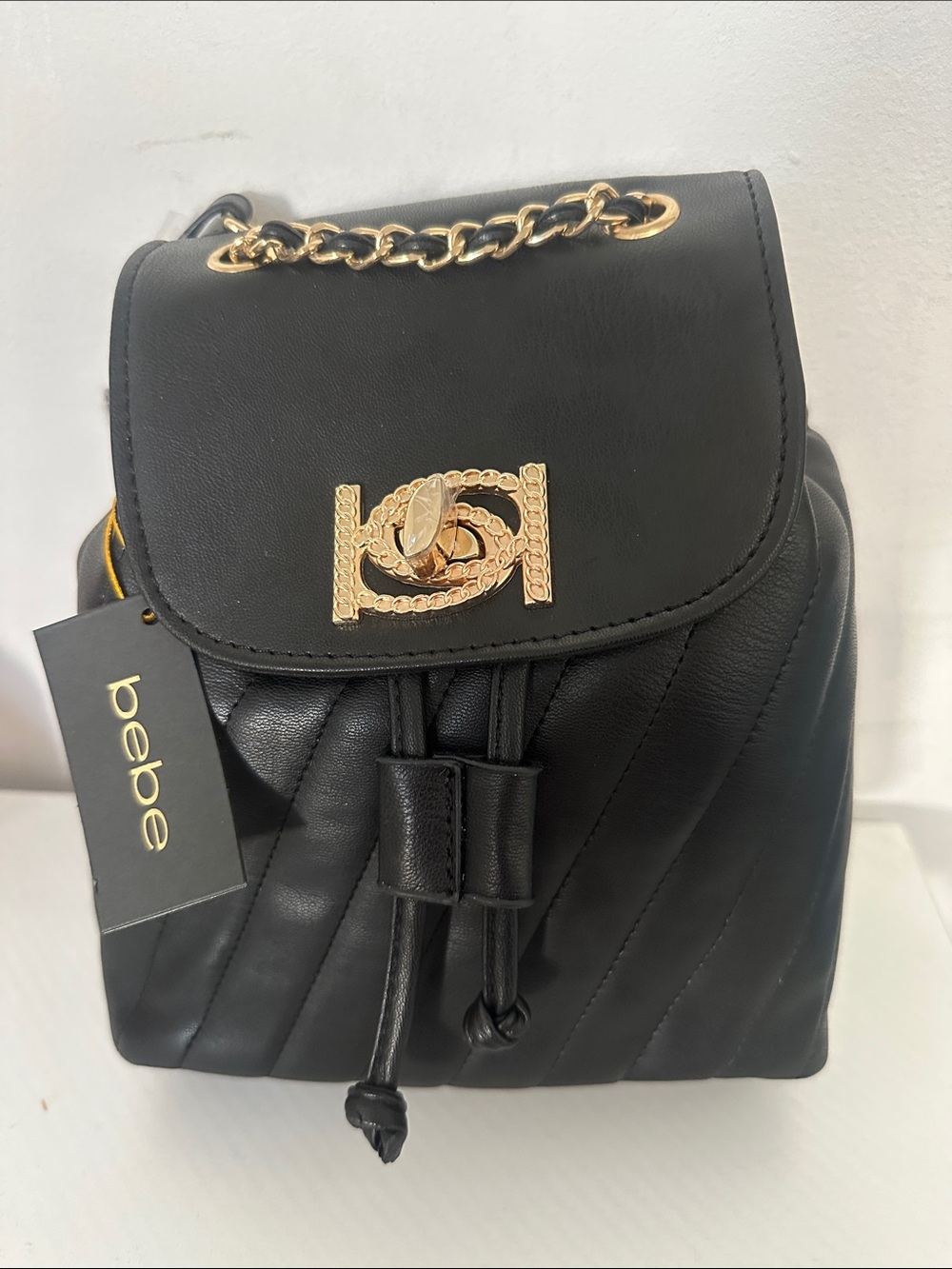 bebe Black Quilted Drawstring Backpack with Gold Chain Accent- Brand New